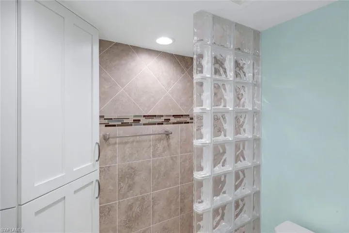 Bathroom featuring walk in shower and recessed lighting