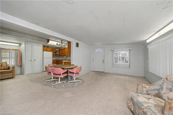 Dining space with light colored carpet