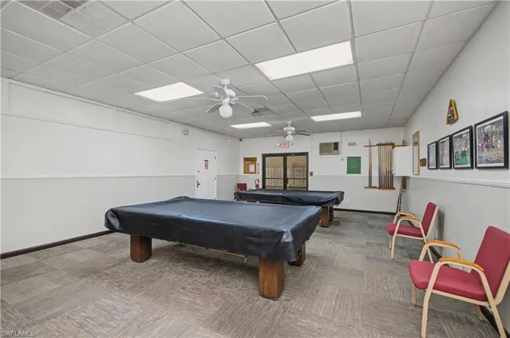 Rec room with ceiling fan, a paneled ceiling, and pool table