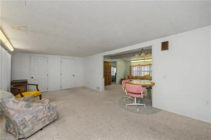 Sitting room featuring carpet