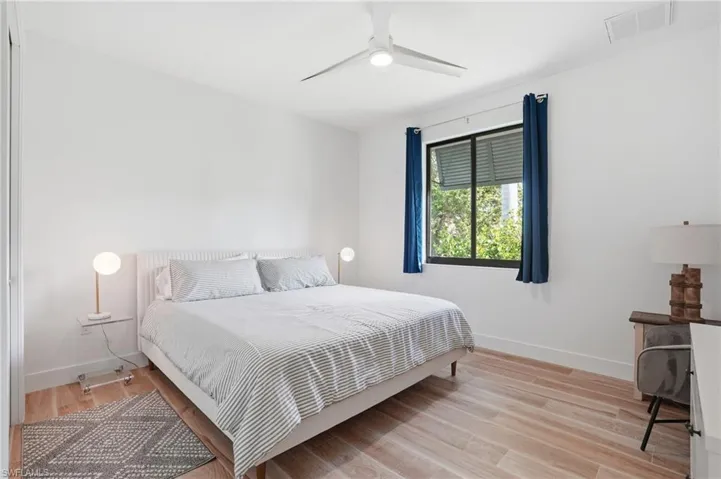 Bedroom featuring light wood-type flooring and a ceiling fan