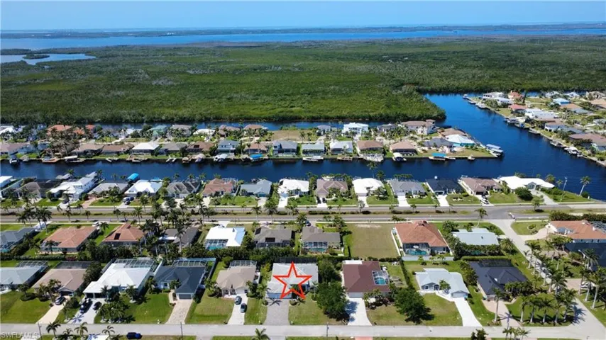 View of property location featuring nearby suburban area and a large body of water