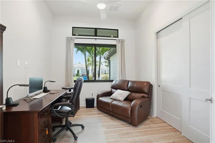 Home office with wood tiled floors and baseboards