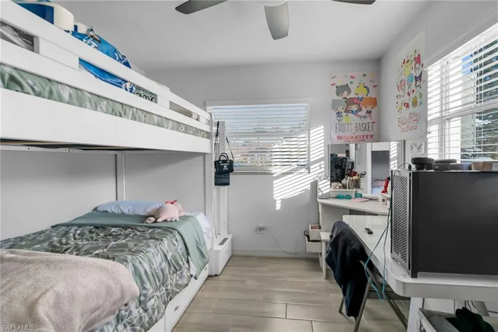 Bedroom featuring ceiling fan and light hardwood / wood-style floors
