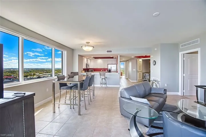 Dining room featuring light tile patterned flooring and baseboards