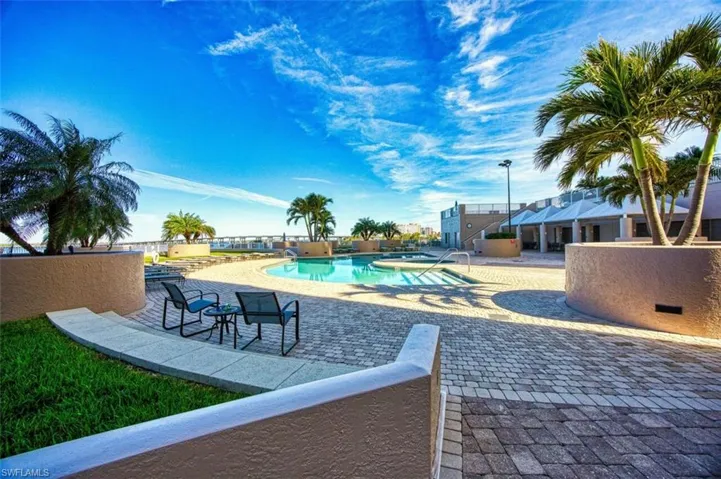 Community pool featuring a patio area