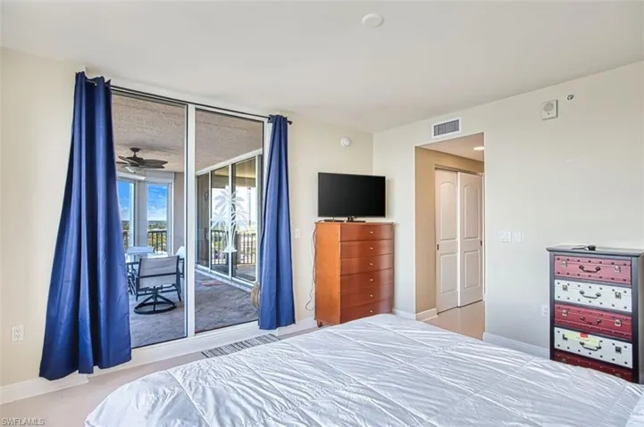 Bedroom with a closet and access to outside