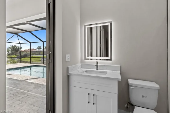 pool/3rd bathroom with vanity and toilet