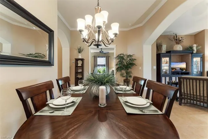 Dining room table has an extra leaf which accommodates 8 comfortably.