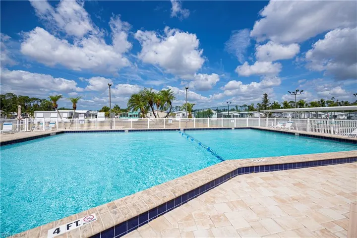 Community pool with a patio area