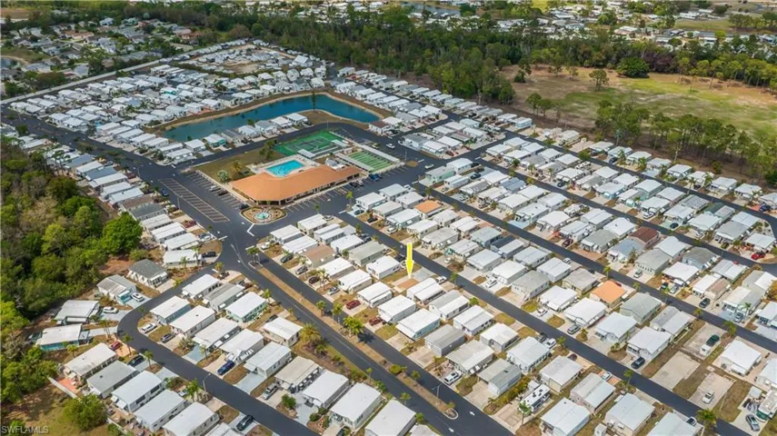 Aerial overview of property's location featuring nearby suburban area