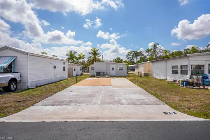 RV Lot featuring a front yard and driveway