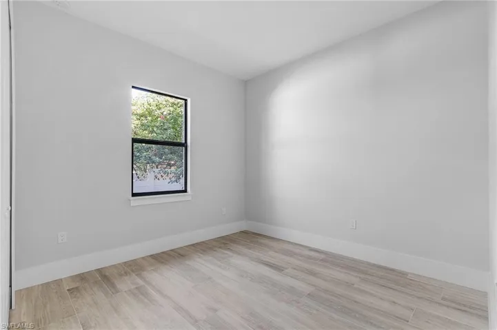 Empty room featuring light wood-style floors and baseboards
