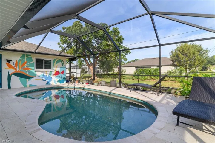 Swimming pool with glass enclosure, a sunroom, and a patio area