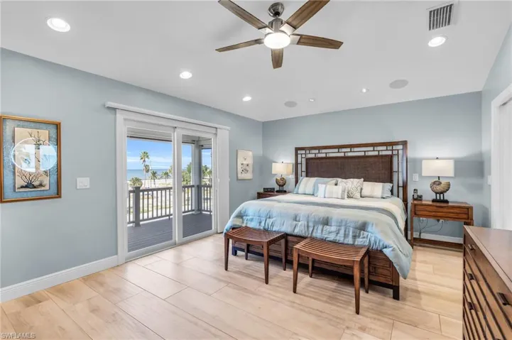 Bedroom featuring ceiling fan, light hardwood / wood-style floors, and access to outside /  virtually enhanced photo
