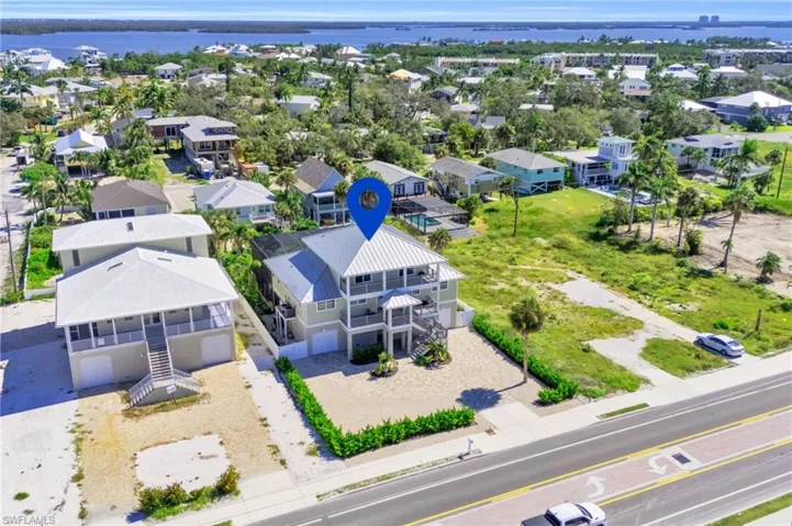 Aerial view featuring a water view.  virtually enhanced photo