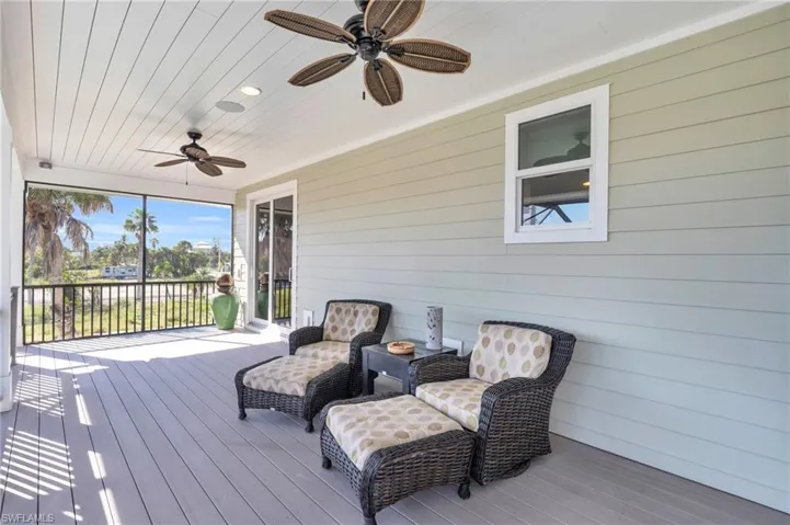 Deck featuring ceiling fan.  virtually enhanced photo