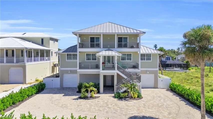 View of front of house with a balcony and a garage VIRTUALLY ENHANCED