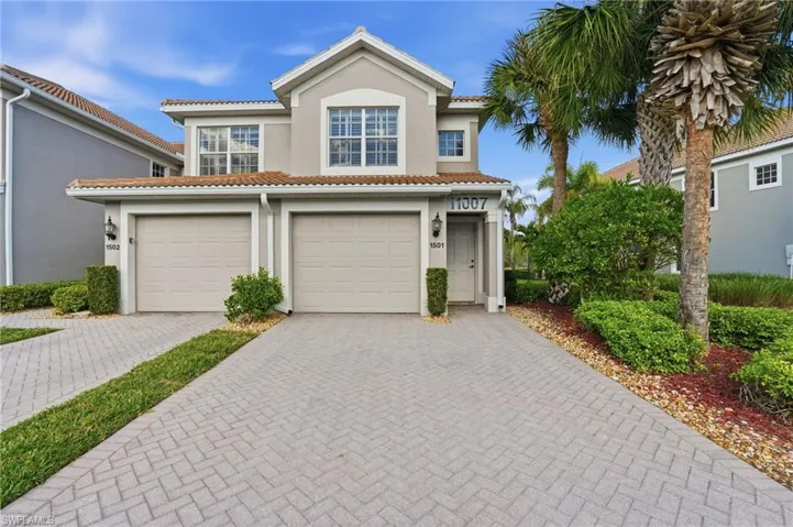 Mediterranean / spanish-style home with decorative driveway, stucco siding, a garage, and a tile roof
