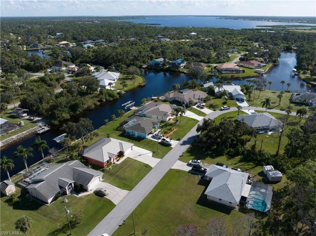 High aerial view of home, canal network and the Myakka river