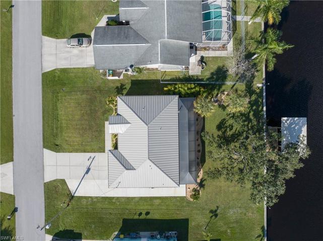 Direct aerial view of home with new metal roof