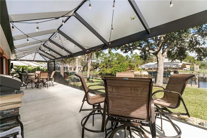 Long view of lanai, 52 ft long with ceiling covered with Florida screening