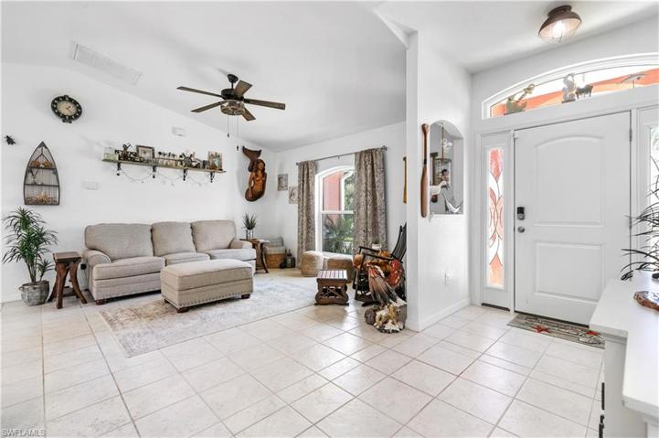 Reverse view of living room and entry