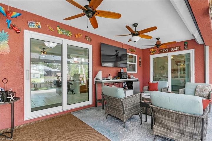 Corner view of under roof lanai with rolldown shutters