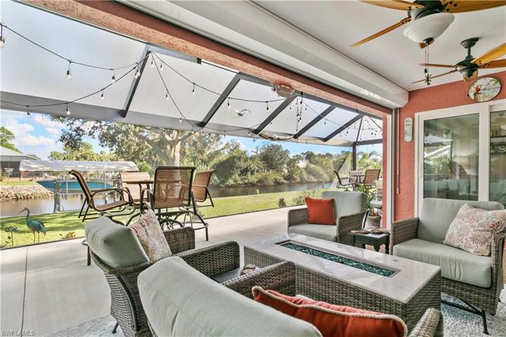 View of extended lanai, backyard and boat lift