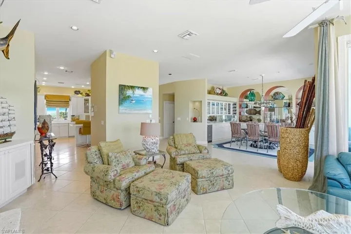 Spacious interior featuring ceramic tile flooring, recessed lighting, and an open-concept design