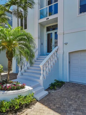 Grand entrance featuring a balustrade staircase