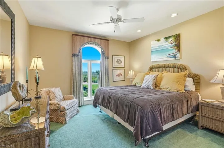 Arched window with decorative valance and drapery panels