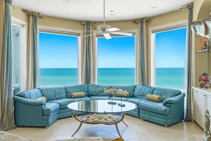 Expansive window wall with ocean backdrop