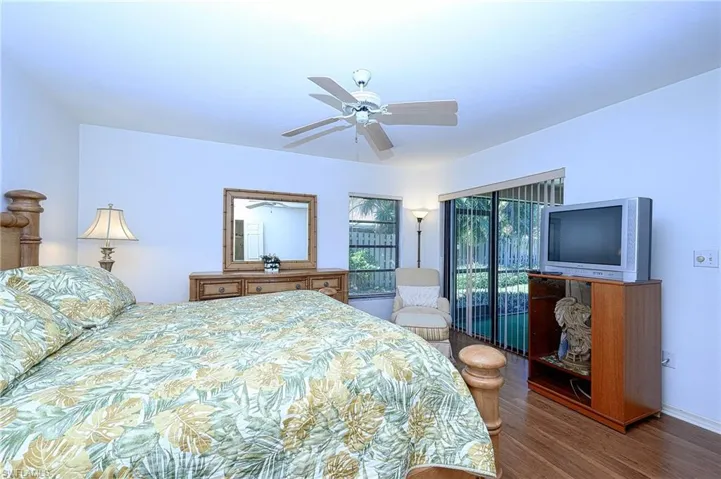 Bedroom featuring ceiling fan and wood-type flooring