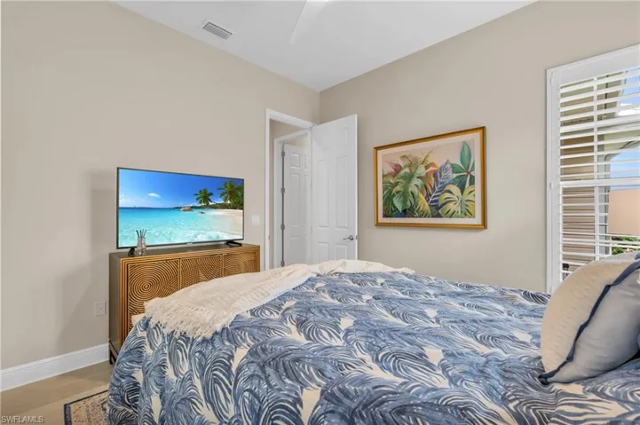 Bedroom with light wood-type flooring and ceiling fan
