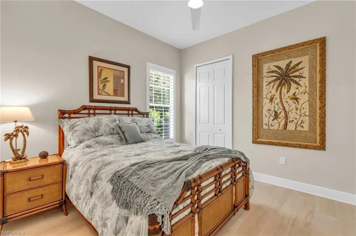 Bedroom featuring ceiling fan and a closet