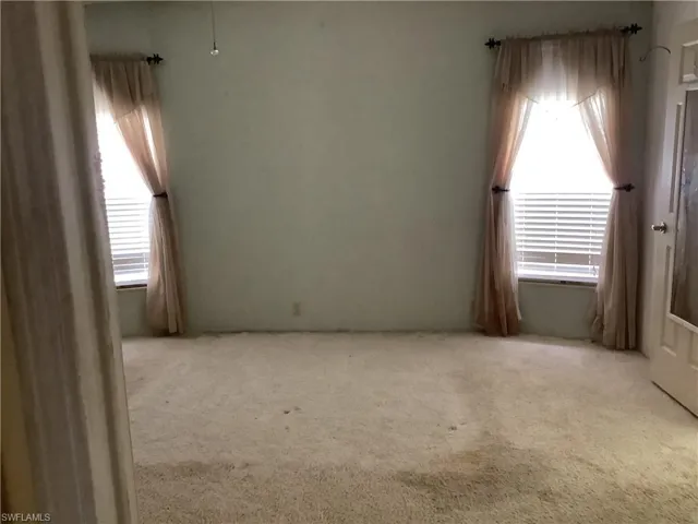 Unfurnished room featuring carpet