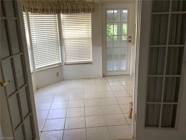 Spare room with light tile patterned floors
