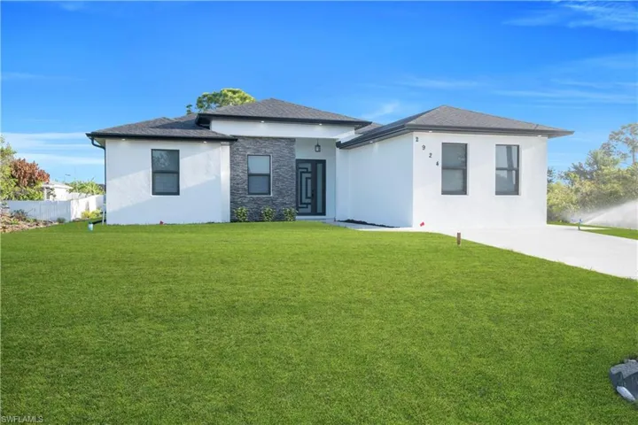 Prairie-style house with stucco siding and stone siding