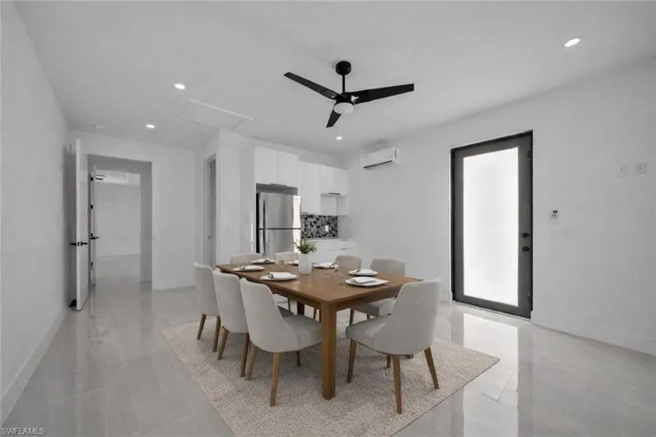 Dining space featuring ceiling fan, a wall mounted mini split, and recessed lighting