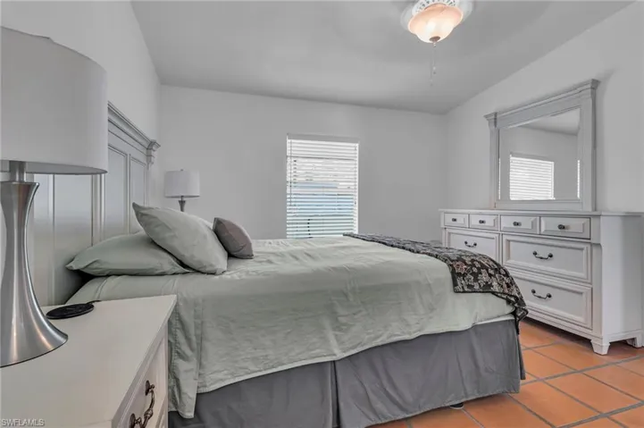 Bedroom with light tile patterned floors