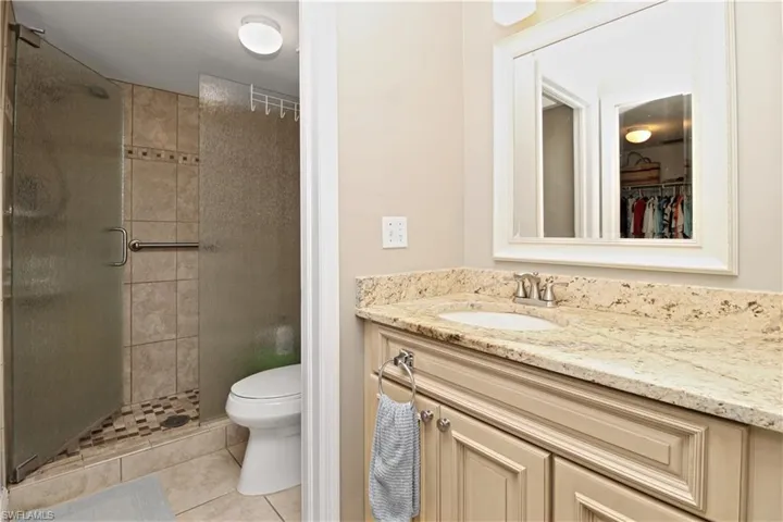 Primary bath with updated walk-in shower.