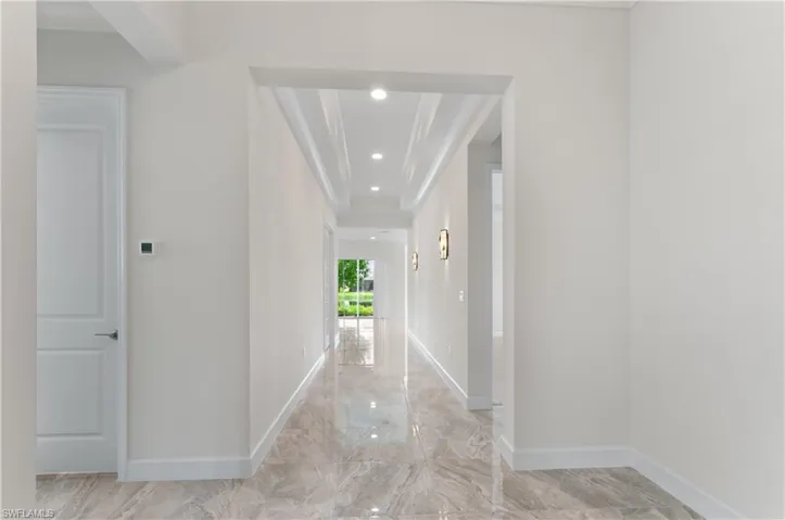 Front Hall with porcelain tile floors and crown molding