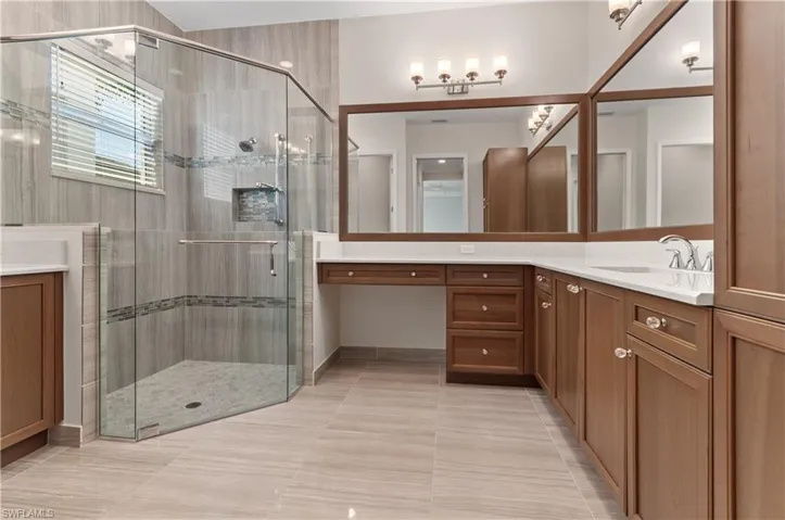 Primary Bathroom with walk in shower, and dual vanities