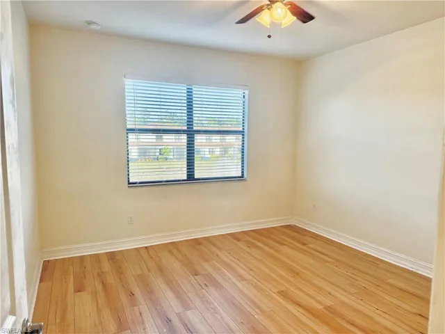 Unfurnished room featuring light wood finished floors and ceiling fan