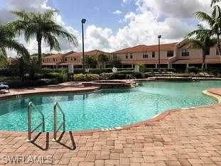 Community pool featuring a patio area