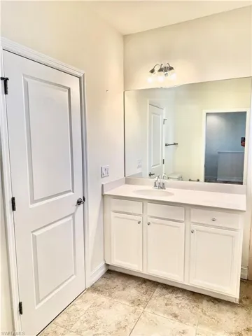Bathroom with vanity and toilet