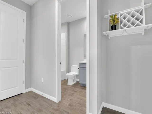 Bathroom with vanity, toilet, tub shower