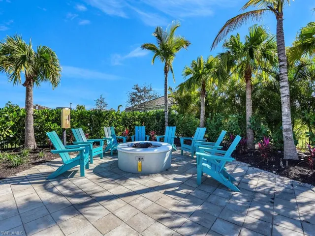 View of patio with a fire pit