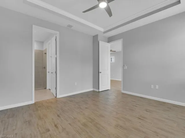 Unfurnished main room with ceiling fan with private bathroom